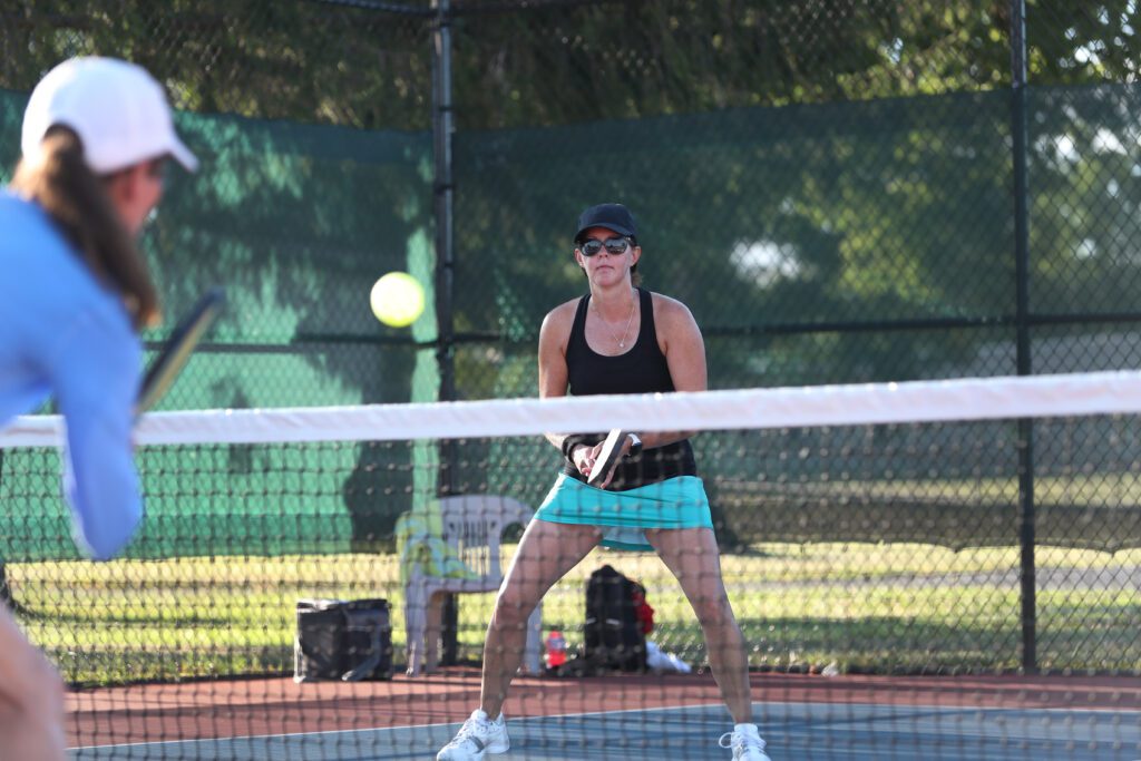 ladies playing pickleball