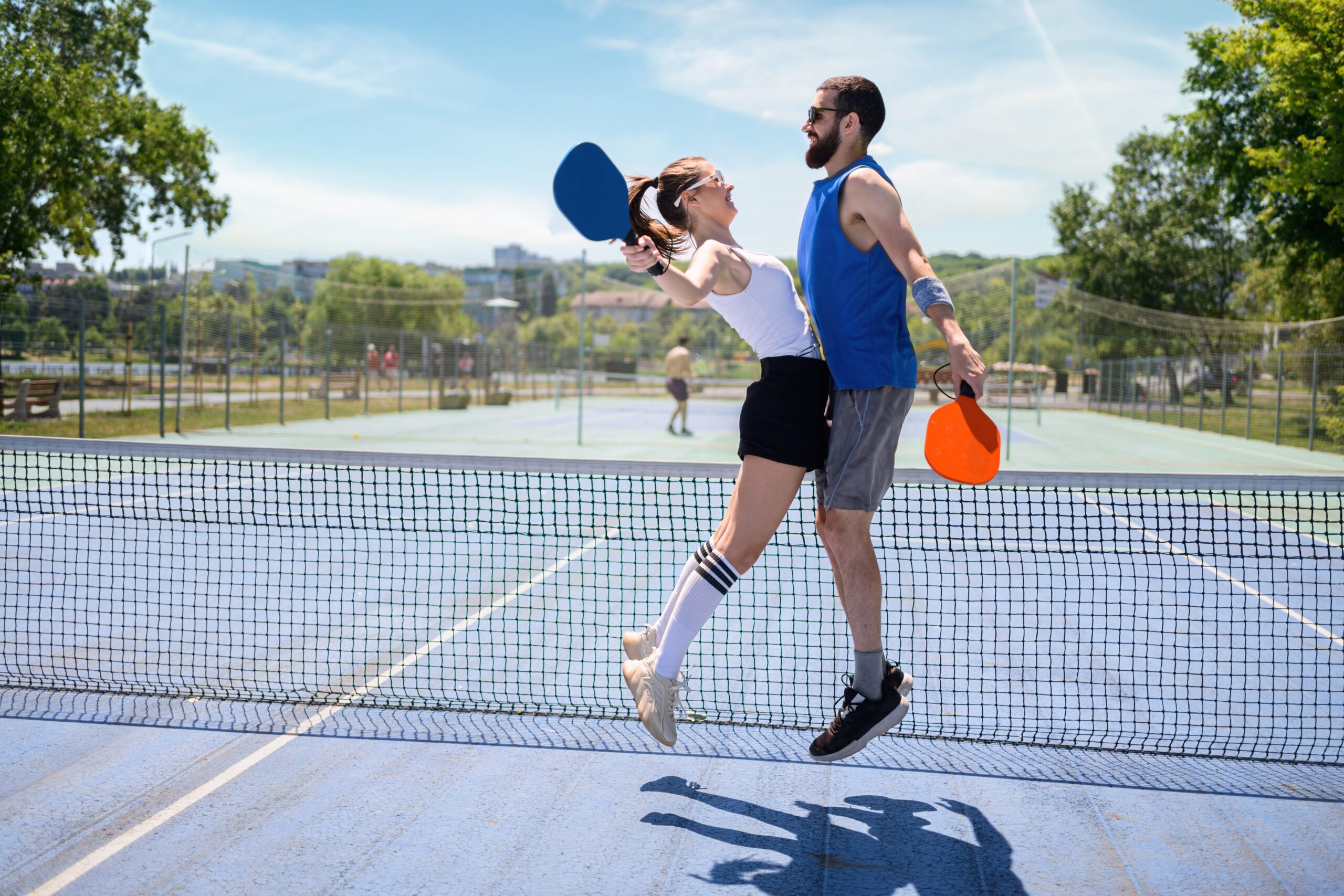 Couple playing pickleball